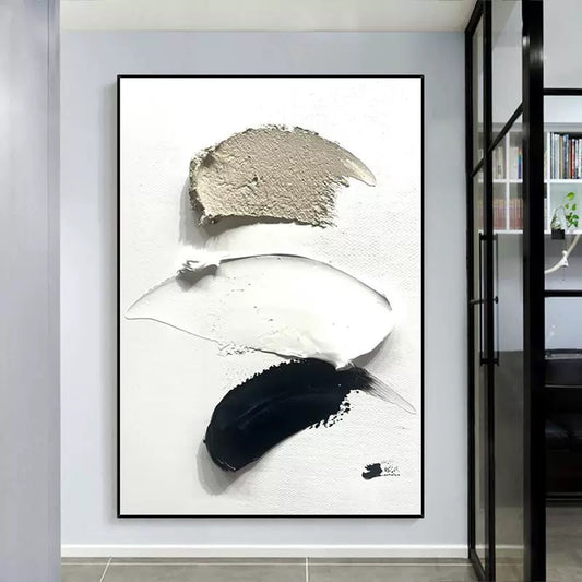 Abstract art piece with black, white, and gray brush strokes in a modern interior setting.