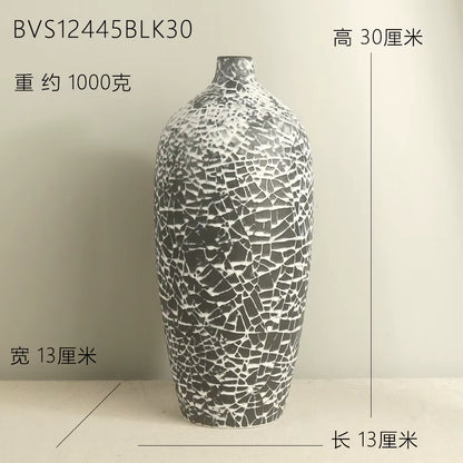 Decorative vase with mosaic pattern on a plain background