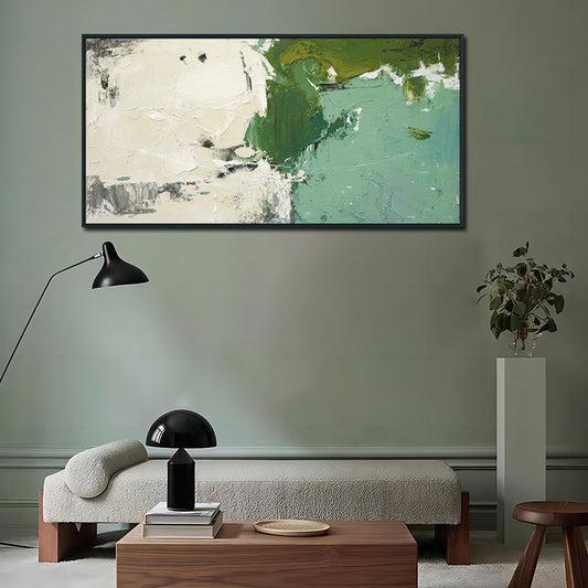 Modern living room with abstract painting, lamp, and decor items.