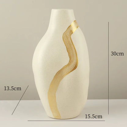 White vase with gold accents and measurements on a gray background