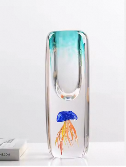 Glass vase with a jellyfish design on a white background