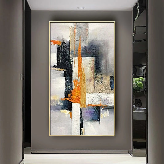 Abstract art painting in a gold frame on a gray wall