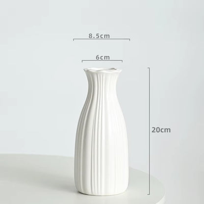 White ceramic vase with dimensions on a light gray background
