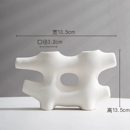 White abstract vase with dimensions indicated on a gray background