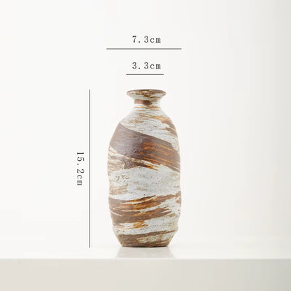 Ceramic vase with dimensions labeled on a white background