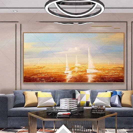 Living room with a large abstract painting of a sunset over water, gray sofa with colorful pillows, and a coffee table.