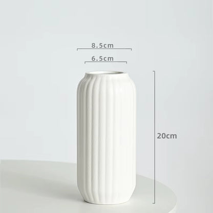 White vase with dimensions on a light gray background