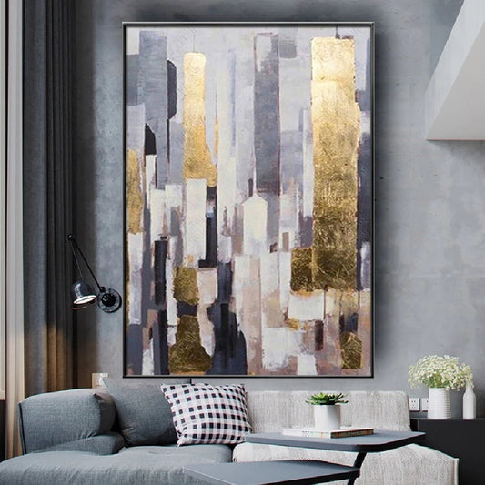 Abstract art piece on a wall above a sofa in a living room