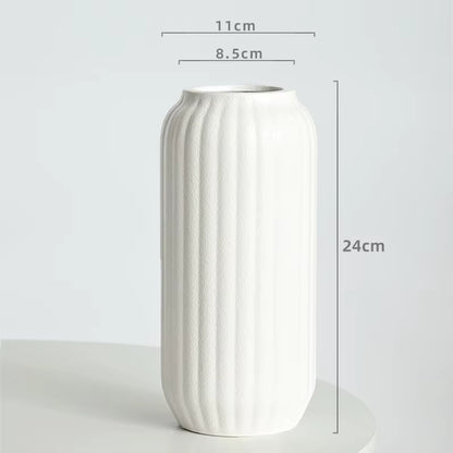 White textured vase with dimensions on a light gray background