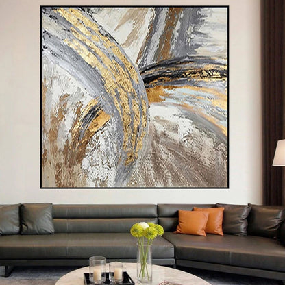 Abstract art painting in a modern living room with a sofa and coffee table.