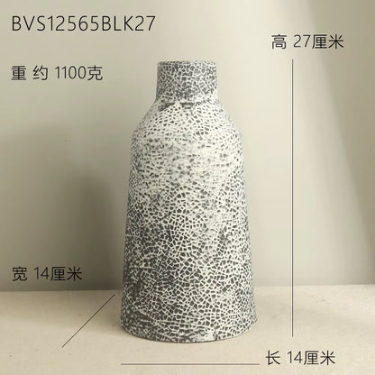 Decorative vase with textured design on a plain background