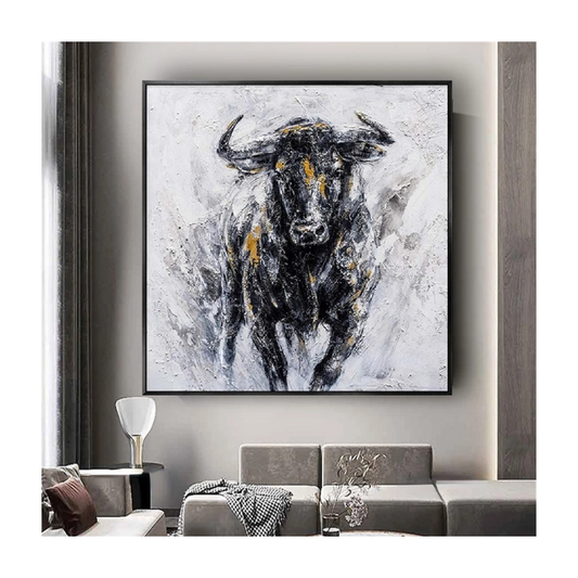 Framed abstract painting of a bull in a modern living room setting