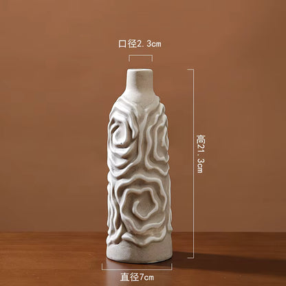 Decorative ceramic vase with textured design on a brown background