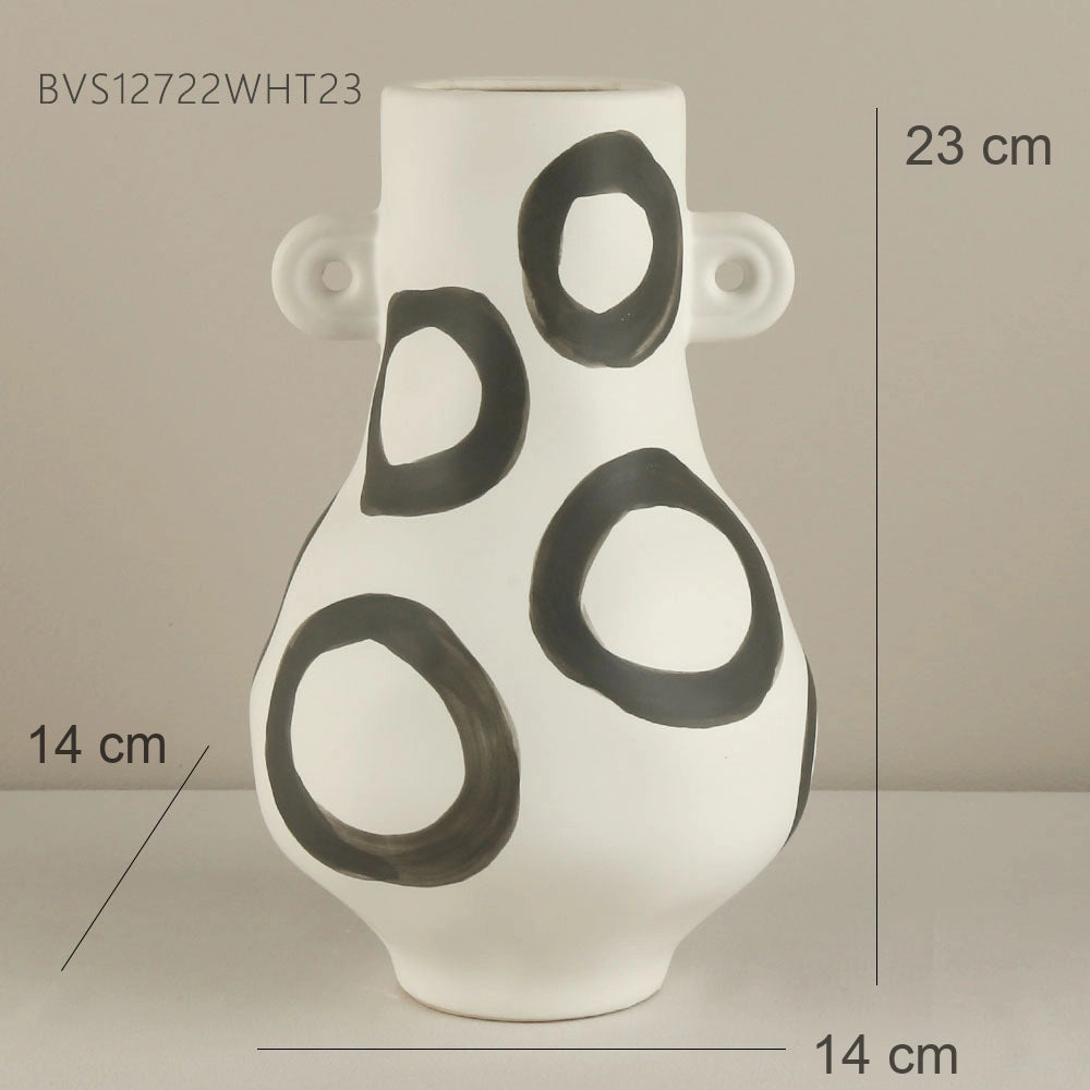 White vase with black circular patterns and measurements on a neutral background