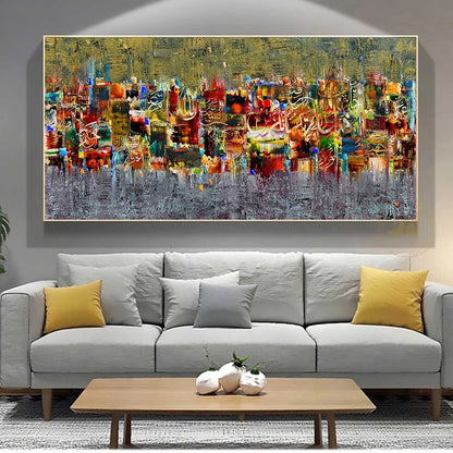 Abstract painting on a wall above a gray sofa with yellow and gray cushions.