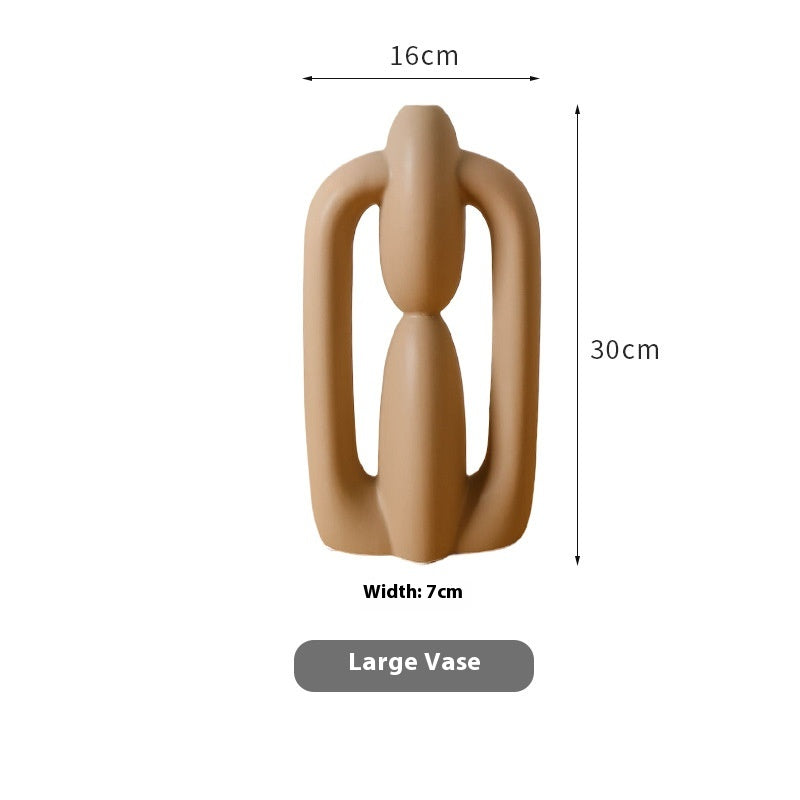 Brown abstract vase with measurements on a white background