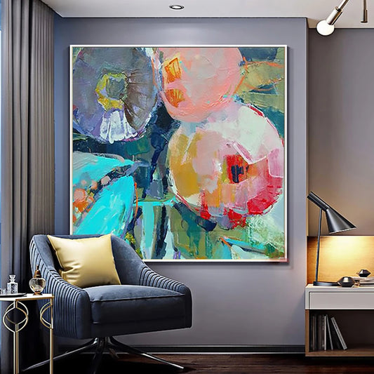 Modern living room with abstract art on the wall, a chair, and a lamp.