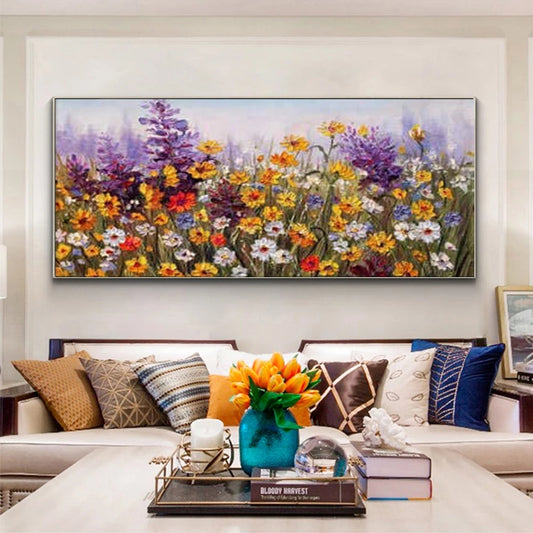 Colorful floral painting on a wall above a sofa with decorative pillows and a coffee table.