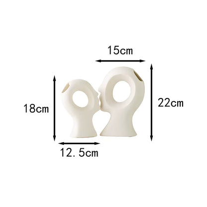 Measurement chart with two white ceramic pieces and their dimensions on a white background