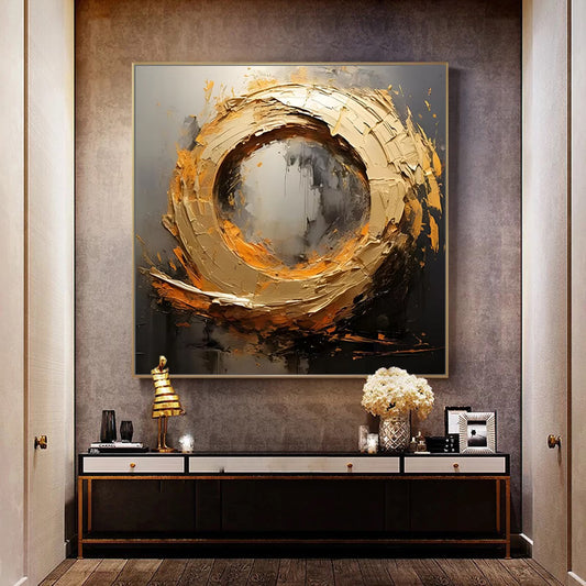 Abstract art piece on a wall above a console table in a stylish interior setting.