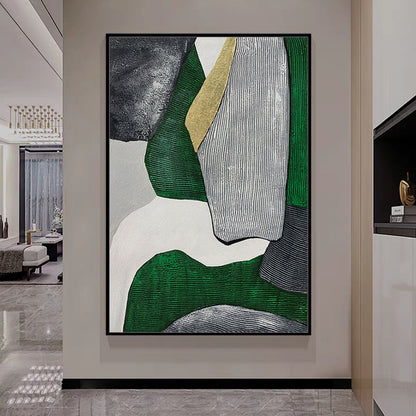 Abstract art piece with green, gray, and white colors in a modern interior setting.