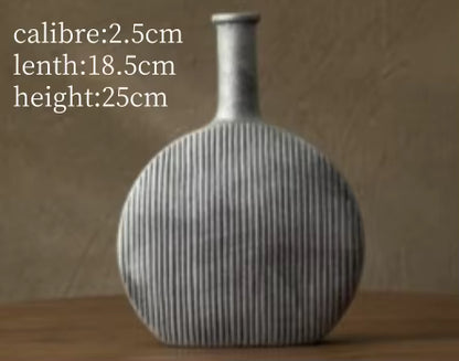 Textured vase on a wooden surface with measurements displayed
