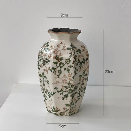 Decorative vase with floral patterns and measurements on a white background