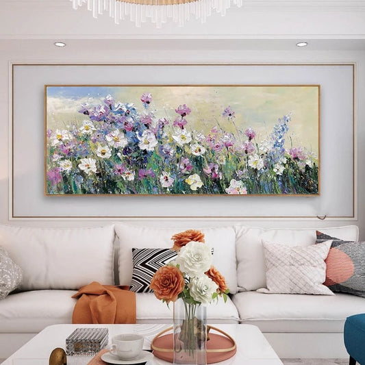Floral painting above a white sofa in a living room