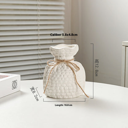 White textured diffuser with twine on a light surface, with measurements displayed.
