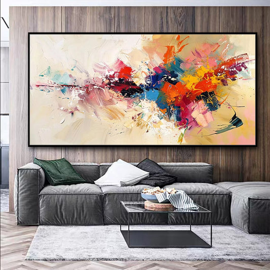Colorful abstract painting on a wall above a gray sofa in a living room.