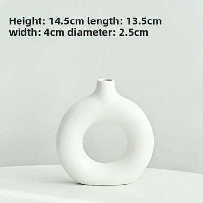 White vase on a light gray background with dimensions displayed