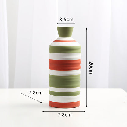 Striped vase with measurements on a white background