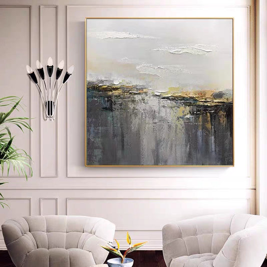 Abstract painting in a living room with a sofa and decorative elements.