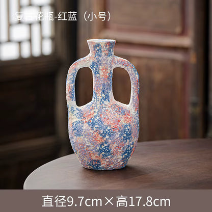 Decorative vase with multicolor pattern on a wooden surface