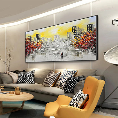 Modern living room with a large abstract painting on the wall, gray sofa with patterned cushions, and yellow armchair.