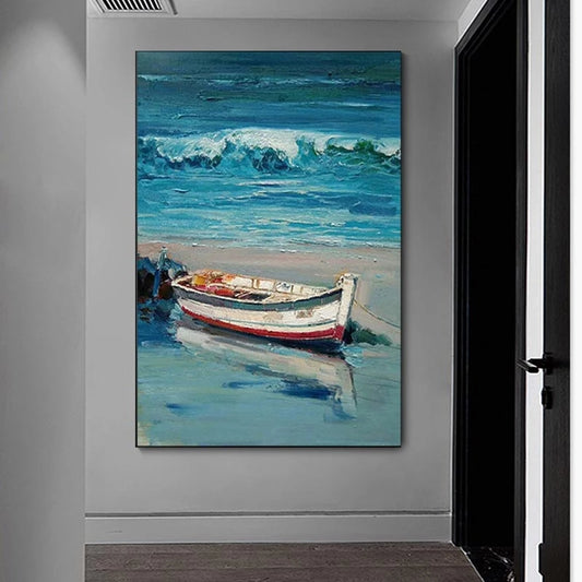 Painting of a boat on a beach hanging on a wall.