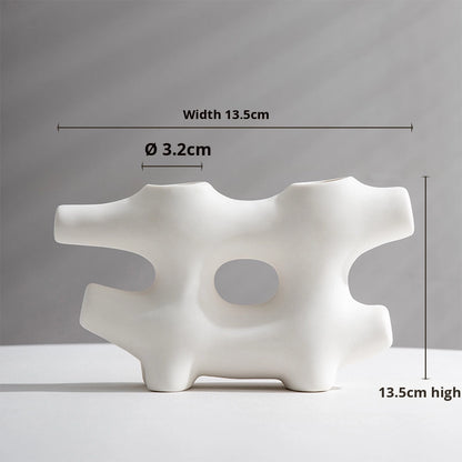 White abstract sculpture with dimensions labeled on a gray background