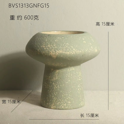 Green ceramic vase on a light gray background with dimensions and weight information.
