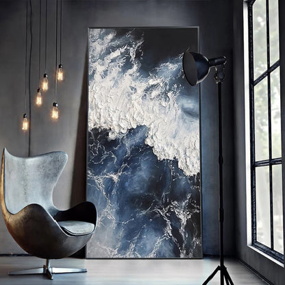 Modern interior with a marble-patterned wall art piece, chair, and floor lamp.