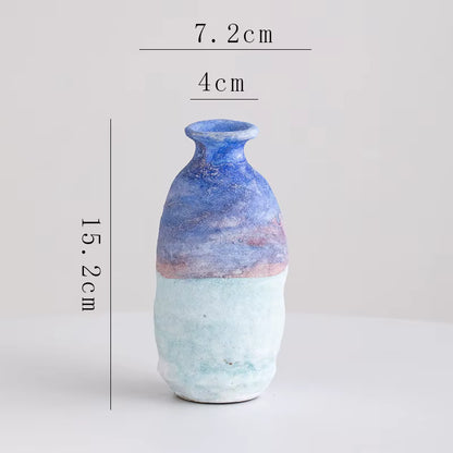 Ceramic vase with measurements on a light gray background