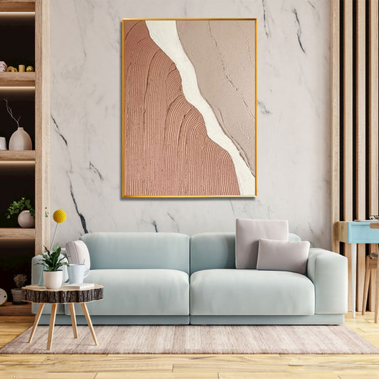 Modern living room with a light blue sofa, abstract art on the wall, and a small round table.