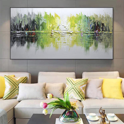 Abstract painting on a wall above a beige sofa with colorful cushions in a living room setting.