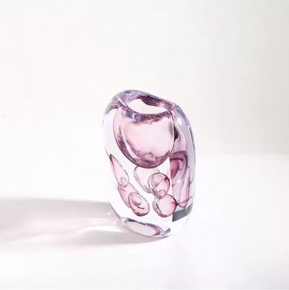 Pink glass vase on a white background