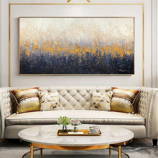 Living room with a tufted sofa, marble coffee table, and abstract painting on the wall.