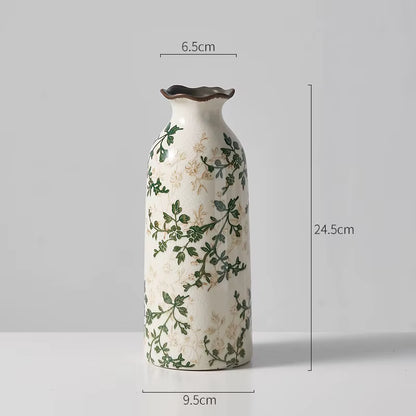 Ceramic vase with floral patterns and dimensions on a gray background