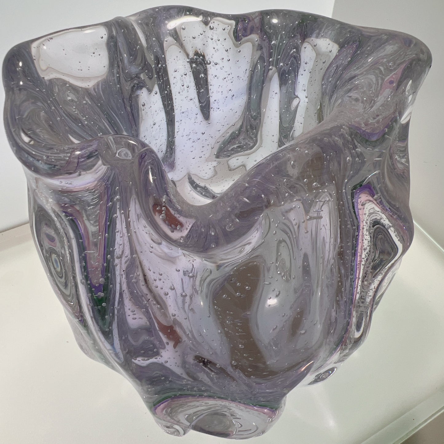 Glass vase with marbled design on a white background