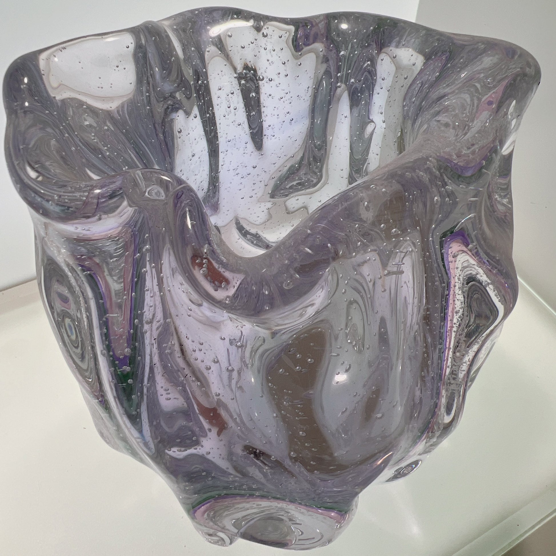 Glass vase with marbled design on a white background