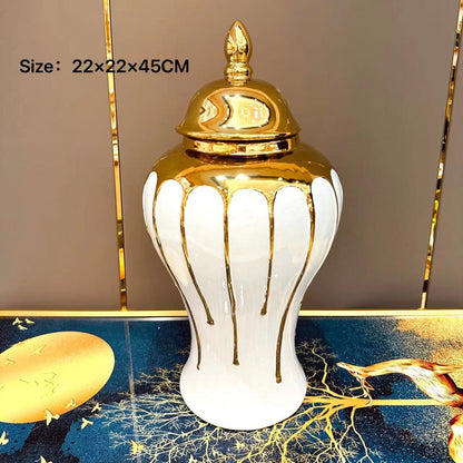 Decorative white vase with gold accents on a decorative surface