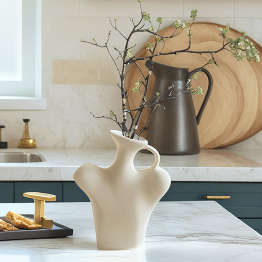 Decorative vase with branches on a kitchen counter