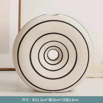 Round decorative item with concentric circles on a light background